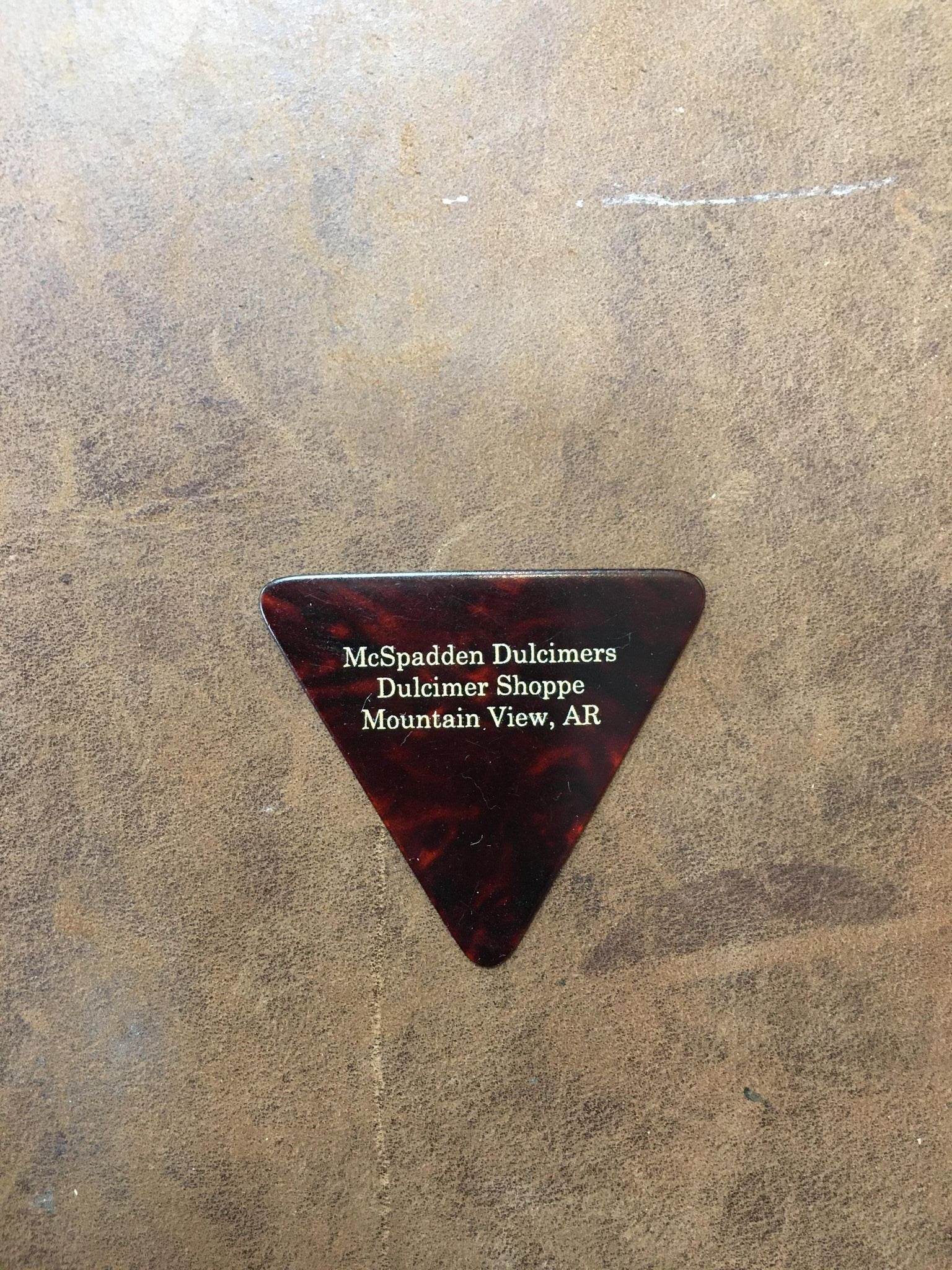 A Triangle pick with the words Nashville Diamonds on it.
