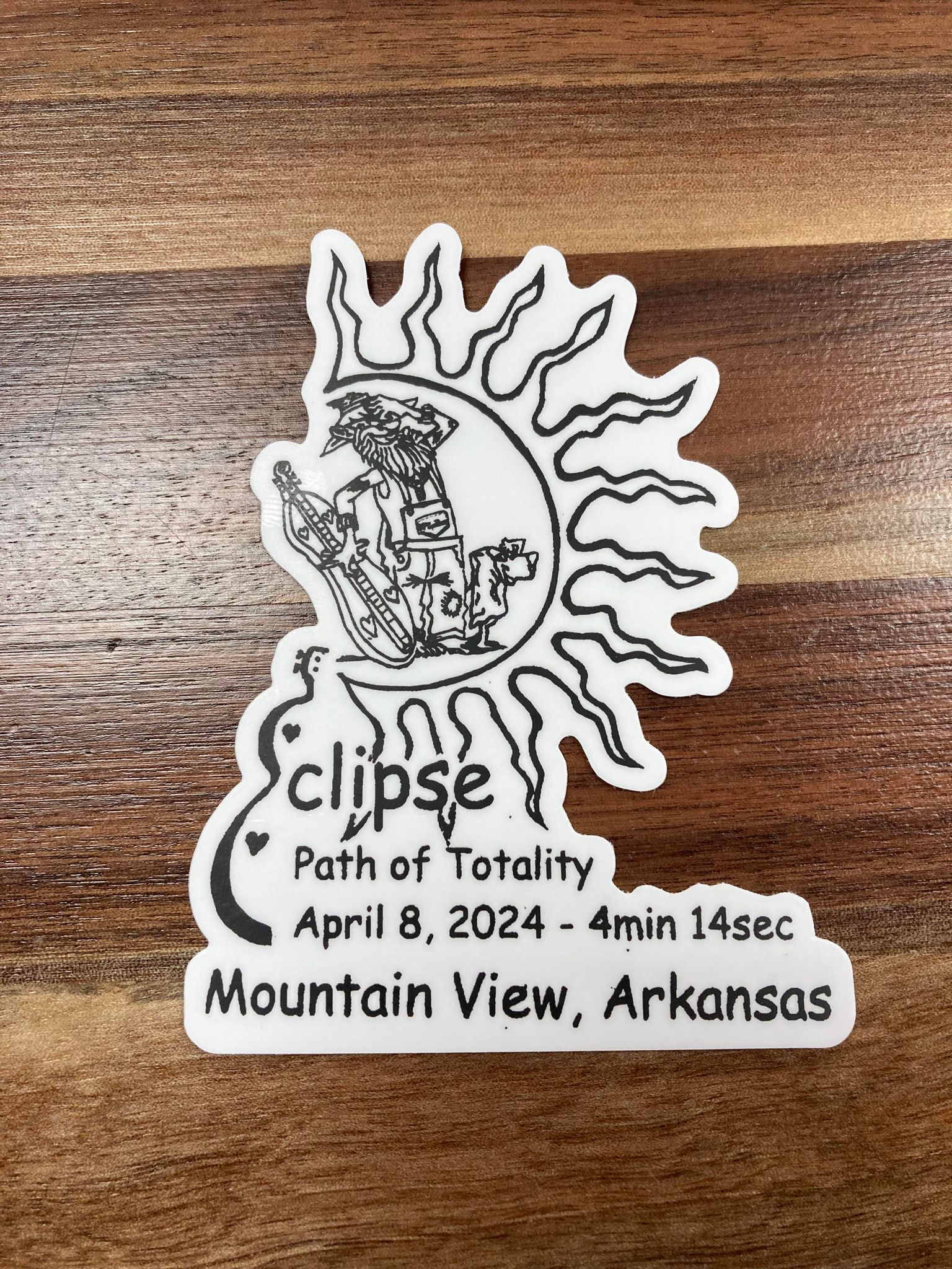 A commemorative McSpadden sticker, perfect for decorating laptops, depicting the solar eclipse event on April 8, 2024, with Mountain View, Arkansas as the location of observation, highlighting the duration of tot