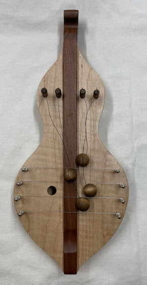 A handcrafted TK O'Brien Door Harps with a string attached to it.
