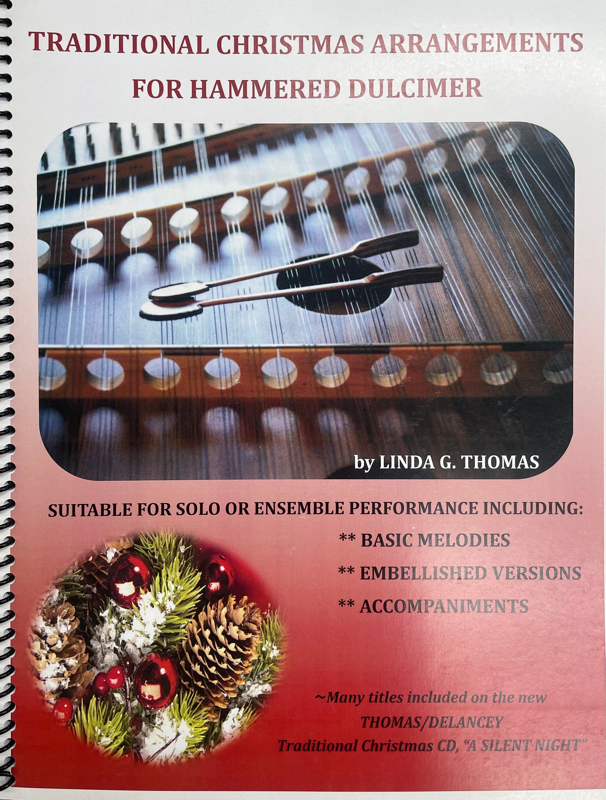 Cover of a book titled "Traditional Christmas Arrangements for Hammered Dulcimer by Linda Thomas," featuring a dulcimer and festive decorations. Includes Basic Melodies, Embellished Versions, Accompaniments, plus embellishment charts for advanced players seeking intricate Holiday arrangements.