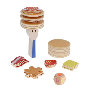 A wooden stacking game with Waffle Topple and other food items, requiring steady hands.