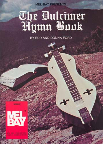 Book cover of "The Dulcimer Hymn Book" by Bud and Donna Ford, featuring an image of a mountain dulcimer on a rocky landscape, with a logo of Mel Bay Publications