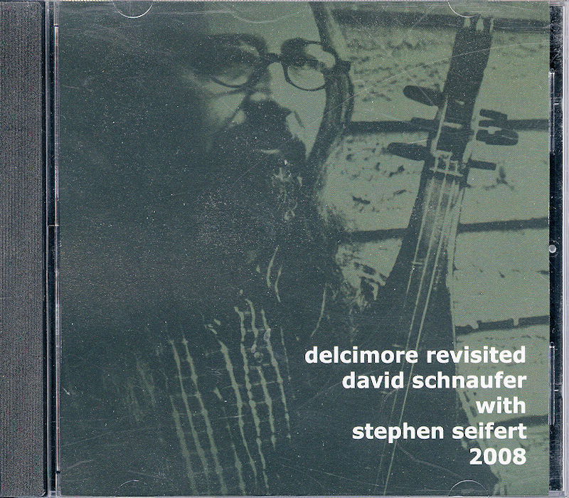 Cd cover featuring a black and white photo of David Schnaufer playing the dulcimer, with overlay text about the album "Delcimore Revisited by David Schnaufer with Stephen Seifert 2008" featuring Stephen Seifert, and artist.