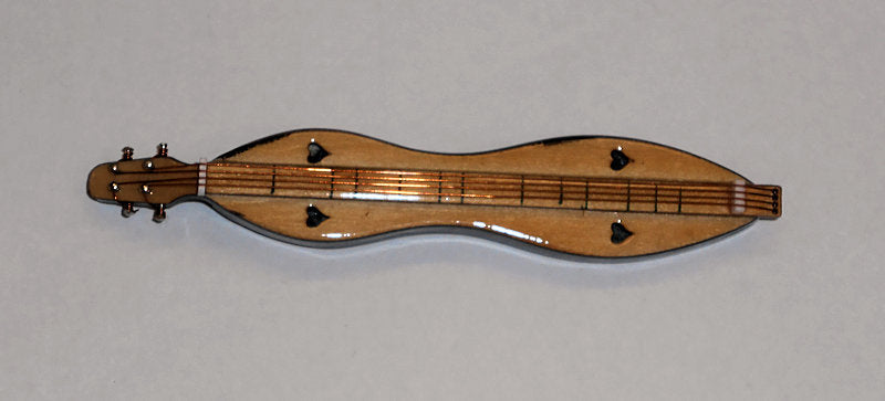 A Lacquered Mountain Dulcimer Magnet, made in the USA, with a laser-cut design, is beautifully displayed on a white background.