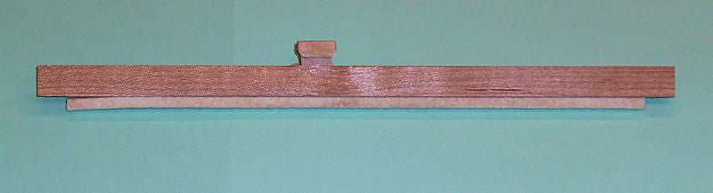 An Evoharp Autoharp Flat Top Chord Bar Buttons hanging on a wall.