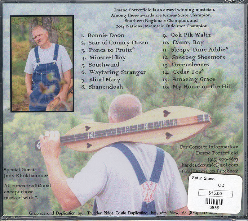 The cover of the award-winning cd Set In Stone - by Duane Porterfield SOLD OUT, featuring a man holding a Mountain Dulcimer.