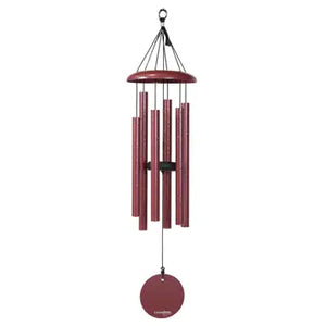 The 27" Windchime Corinthian Bells® in red, featuring multiple metal tubes and a round disc at the bottom, suspended by sleek black cords, enhances any space with elegant decor.