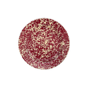 The Splatter Enamelware Dinner Plate features a round ceramic design with a cream base and bold red splatter pattern, inspired by classic enamelware. Photographed from above on a white background, this plate adds a pop of color to your serveware collection and is perfect for stylish entertaining.