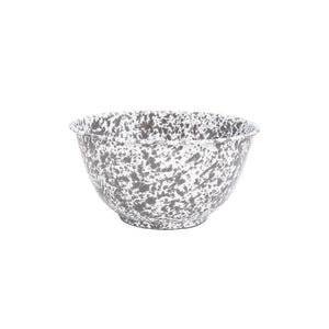 The Splatter Enamelware Large Salad Bowl, with its gray and white speckled design, flared rim, and durable porcelain finish, is displayed against a plain white background.