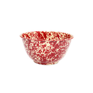 The Splatter Enamelware Large Salad Bowl, featuring a red and white speckled design with a rounded shape and glossy finish, is displayed against a plain white background.