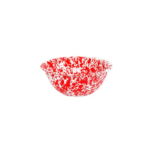 The Splatter Enamelware Small Serving Bowl features a round shape with a white base and vibrant red splatter pattern, making it perfect for serving snacks or treats to guests. It is displayed on a plain white background.