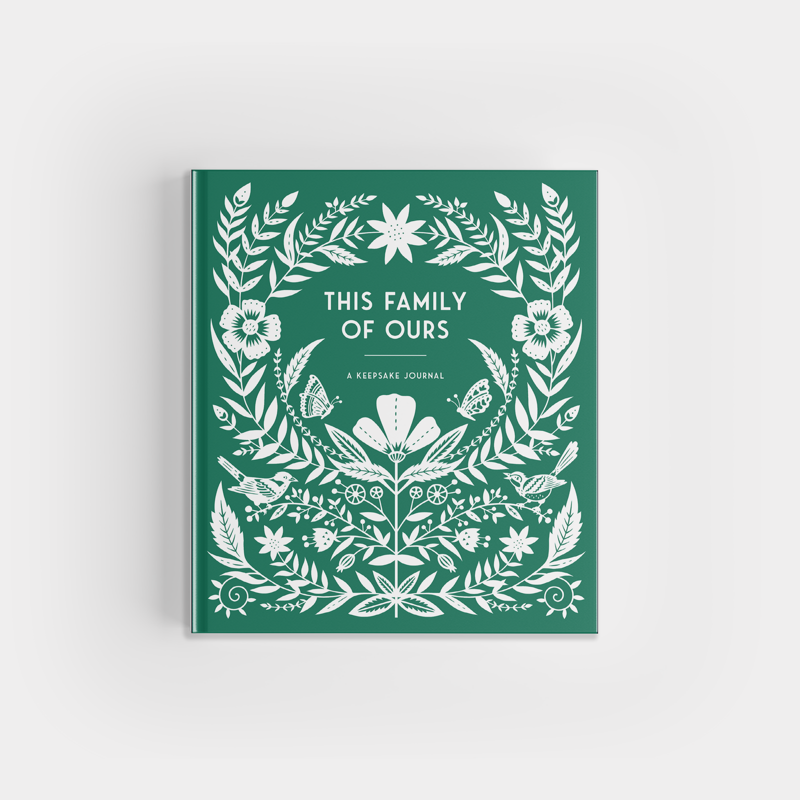 This Family of Ours is a green guided journal with white floral and leaf illustrations—ideal as a family memory book or a thoughtful gift for grandparents.