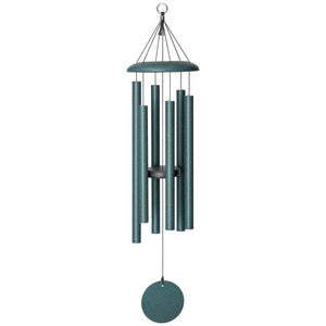 The Corinthian Bells® 36-inch Windchime, a versatile addition to any landscape, features cylindrical metal tubes and a circular wind catcher, all hanging gracefully from a small ring at the top—ideal for complementing your outdoor design.