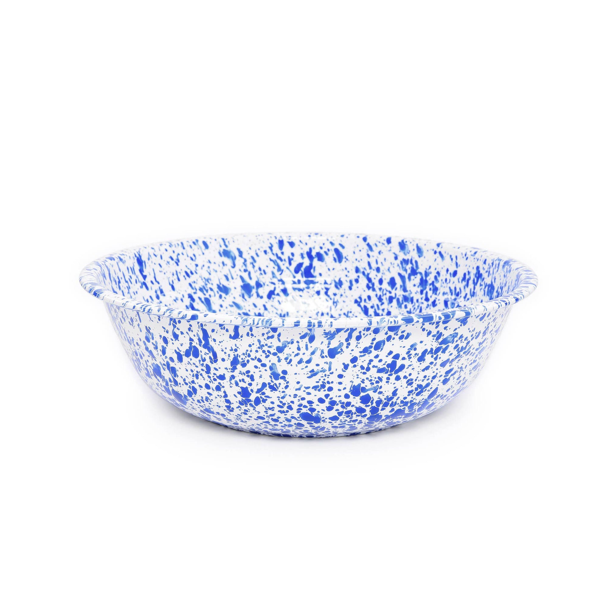 The Splatter Enamelware Medium Basin is a round ceramic bowl featuring a durable white background with a striking blue speckled pattern, making it perfect for versatile use.