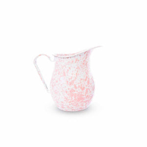 The Splatter Enamelware Large Pitcher, featuring a pink and white speckled design with a curved handle and spout, is perfect for entertaining a crowd.