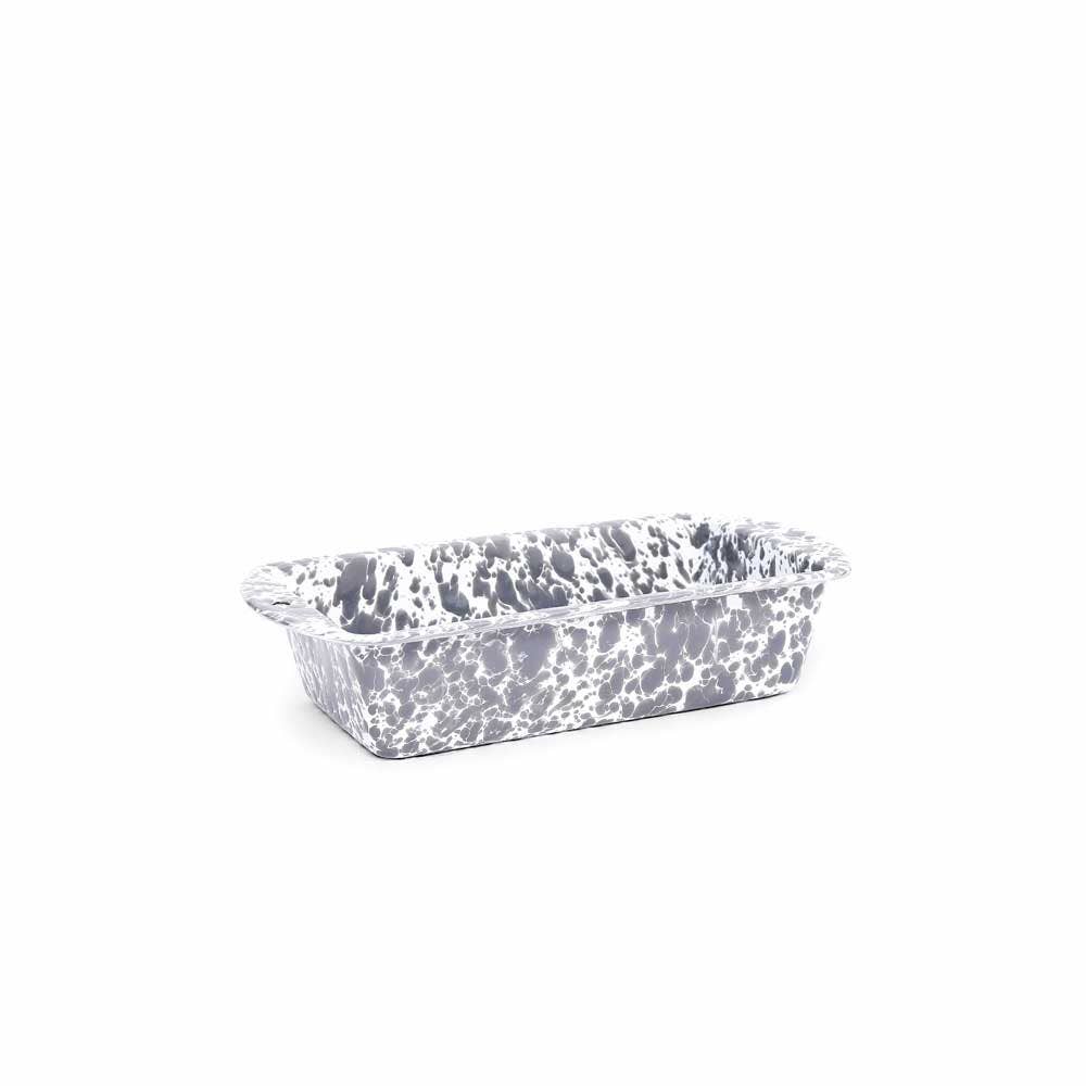 A durable Splatter Enamelware Loaf Pan, showcasing its grey and white speckled design with handles on each end, is beautifully displayed against a plain white background.