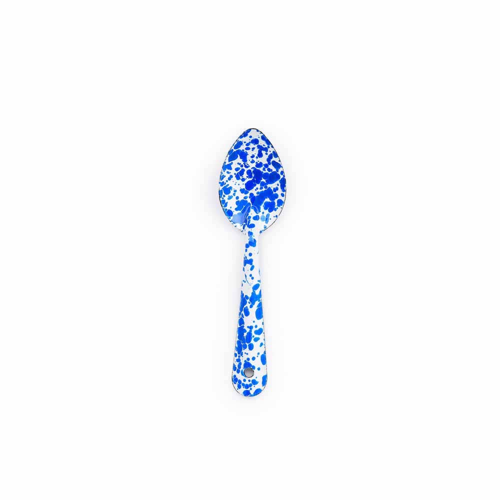 A Splatter Enamelware Medium Spoon, featuring blue speckles on a white enamel background, perfect for entertaining.