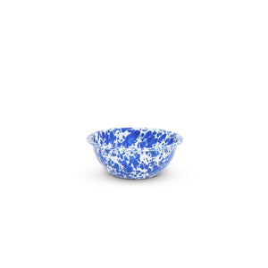 The Splatter Enamelware 20 oz Cereal Bowl, featuring a small blue and white speckled design with a scalloped edge, is perfect for entertaining a crowd and is centered against a plain white background.