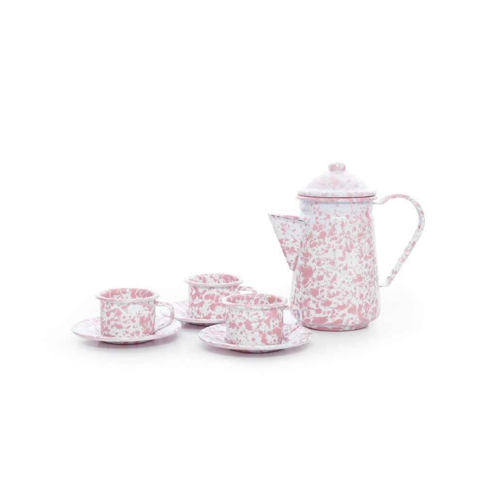 A charming children's tea party set, the Splatter Enamelware Kid's Tea for Three Set, features a shatterproof pink and white speckled teapot with a lid, along with three matching teacups and saucers, all beautifully arranged on a white background.