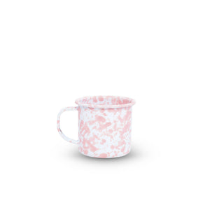 The Splatter Enamelware 12 oz Mug features a pink marbled pattern on white enamelware and is displayed against a plain white background.