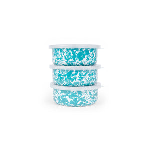 Three stacked bowls from the Splatter Enamelware 3-pc Storage Bowl Set, each 14oz in size with turquoise and white marbling and white lids, are perfect for entertaining a crowd.