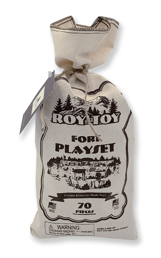 A beige Roy Toy Fort Canvas Bag labeled "ROY TOY FORT PLAYSET" contains 70 all-wood pieces of a classic American-made toy set. This educational toy includes a warning for small parts and is recommended for ages 3 and up.