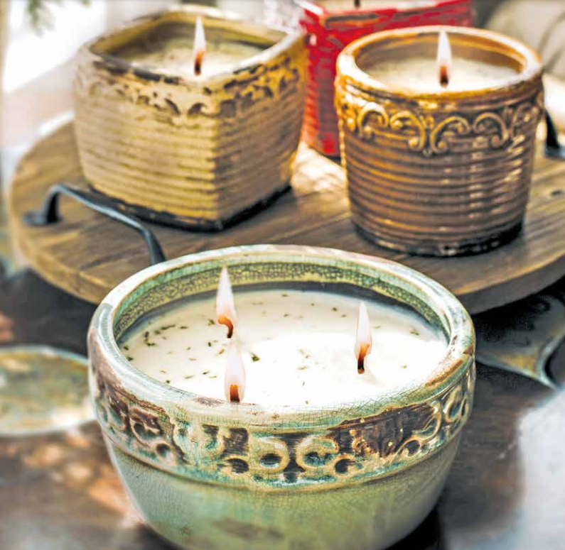Three Vintage Bowl Swan Creek Candles are sitting on a wooden tray, perfect for the gift industry and available at wholesale prices.