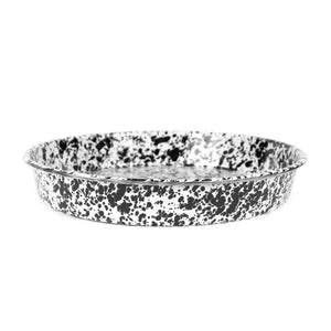 A round, shallow Splatter Enamelware Cocktail Tray/Deep Dish Pizza Pan featuring a black and white marbled pattern on its surface.