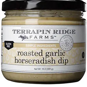 A jar of Terrapin Ridge Roasted Garlic Horseradish Dip with a black lid and white label, noted as gluten free, keto-friendly, and made with simple ingredients.