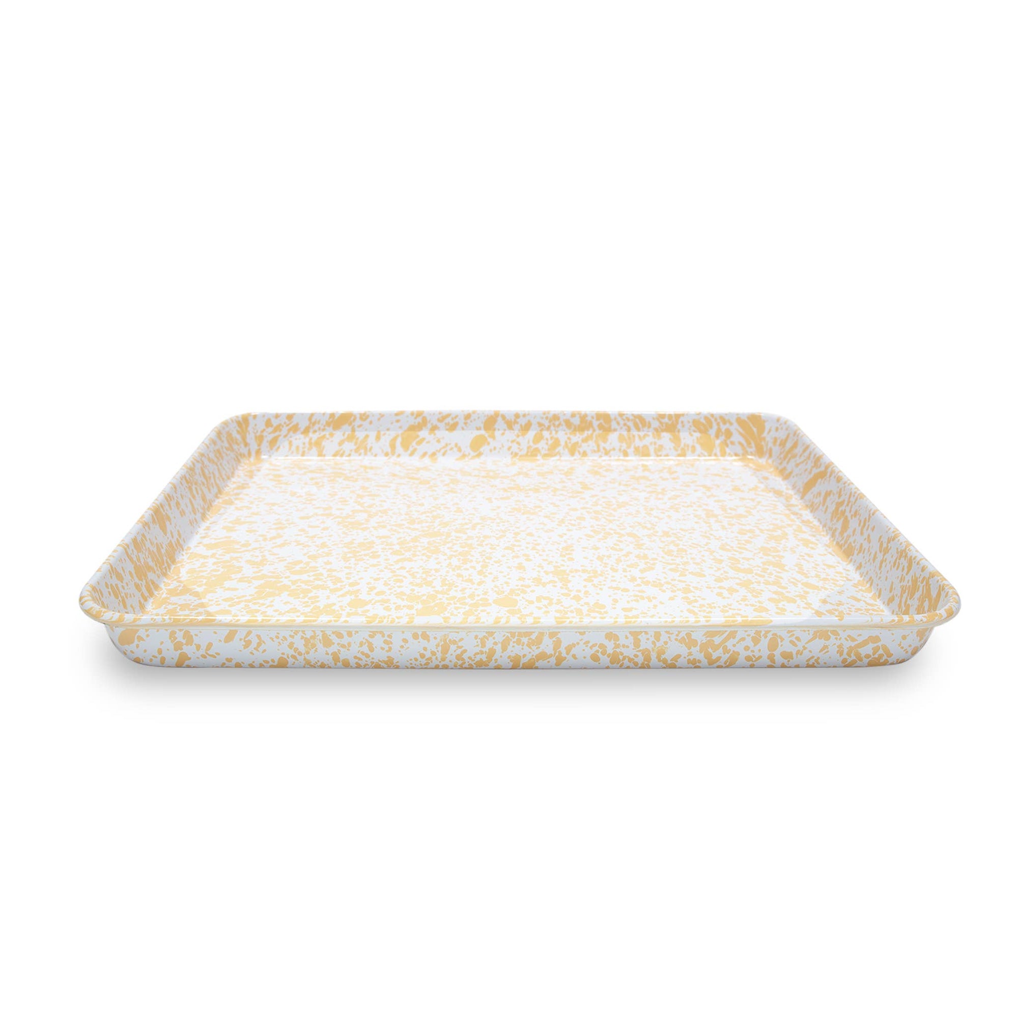 The Splatter Enamelware Large Rectangle/Jelly Roll Tray, characterized by its white and yellow splatter pattern, features slightly raised edges.