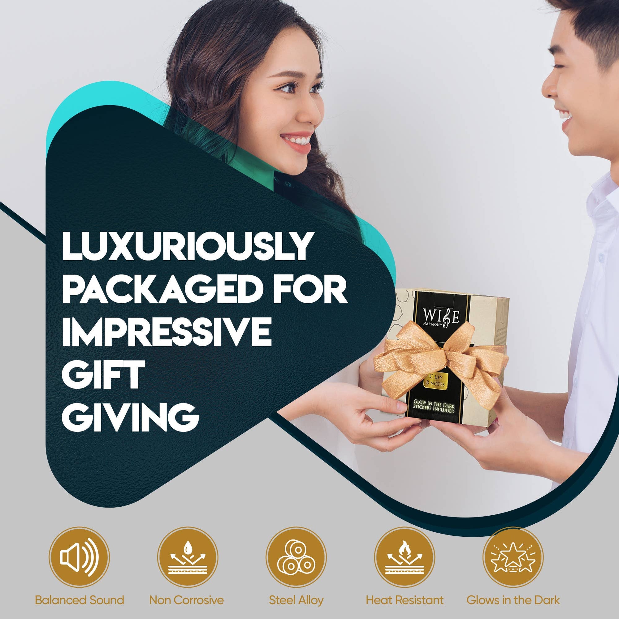 Two people exchanging a gold-wrapped gift box with a bow. Text reads: "Luxuriously packaged for impressive gift giving." Icons below highlight features like balanced sound, non-corrosive steel alloy, heat resistance, and glow-in-the-dark finish—perfect for those seeking relaxation through sound healing with the Steel Tongue Drum 6-Inch 8-Notes.