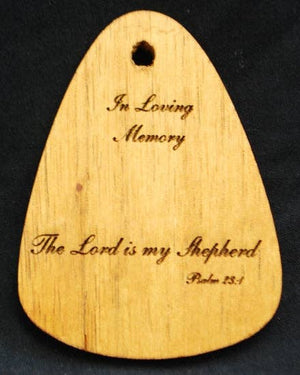 A wooden plaque with the In Loving Memory® Bronze 24-inch Windchime.