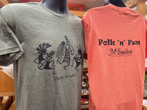 A variety of colored shirts, featuring different designs, are on display in a store.