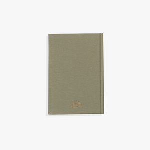 A green Mom's Story guided journal on a white background.