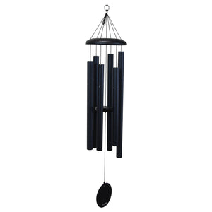 The Corinthian Bells® 44-inch Windchime features a sleek black design with multiple cylindrical tubes suspended from a circular top, perfect for adding depth and flair to your outdoor space.