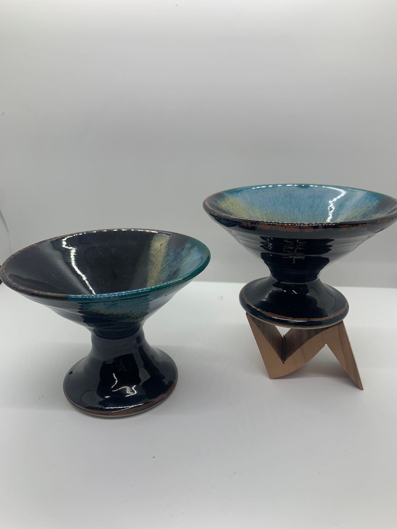 Two Perry Munn Pottery Margarita Glasses on a stand.