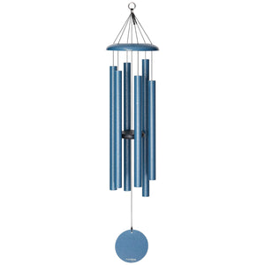 The Corinthian Bells® 44-inch Windchime is a blue wind chime featuring multiple metal tubes suspended from a circular top piece, crafted to produce musical sounds with added flair when moved by the wind.