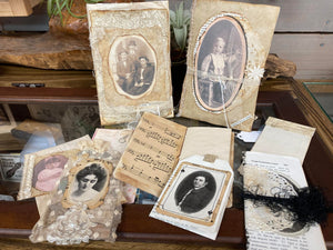 A collection of Mrs. Pat's Junk Journals and other items on a table in a Mountain View home.