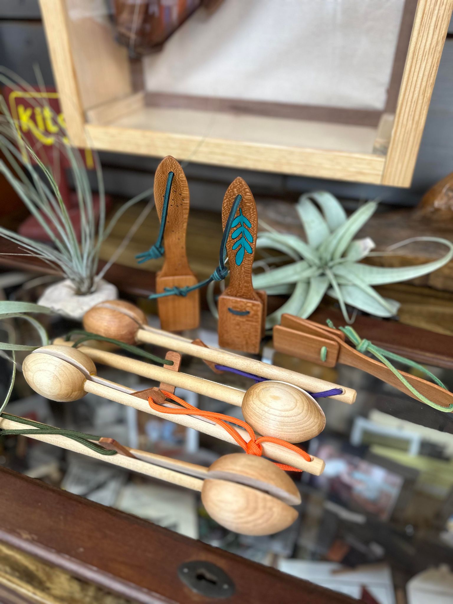 A display of various Neil's Wood Shop Toys on a table.