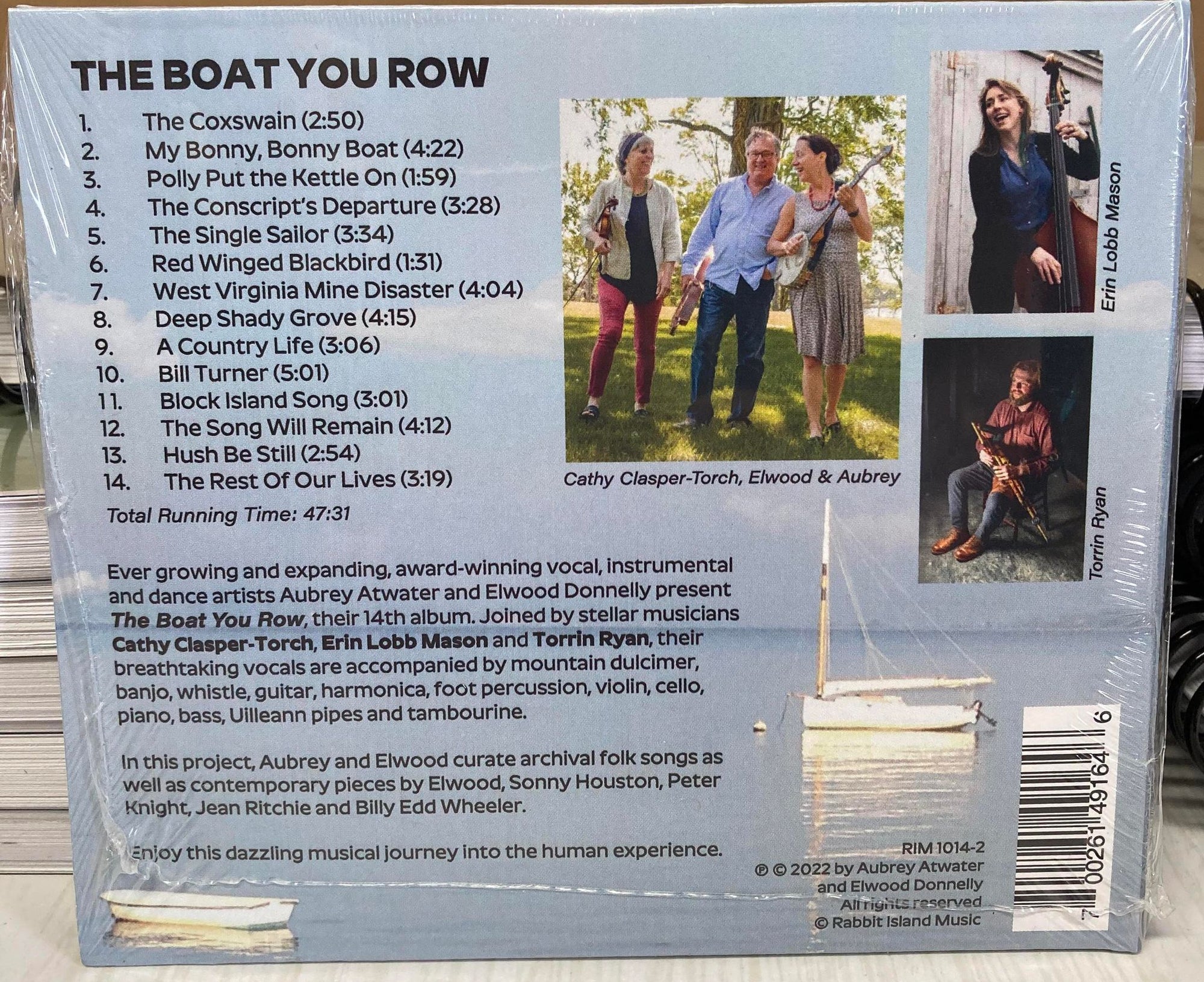 Back cover of the The Boat You Row by Aubrey Atwater CD, showing tracklist, credits, and images of the band members laughing and playing instruments.