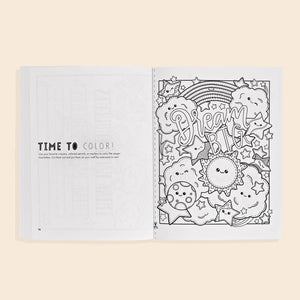 The Gratitude For Kids Mindfulness Activity Book features an open page with a "Time to Color!" prompt and a "Dream Big" coloring scene with clouds, stars, and a rainbow—perfect for inspiring creativity and gratitude in children.