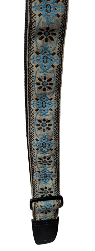 Decorative guitar strap with blue and black patterns on a white background