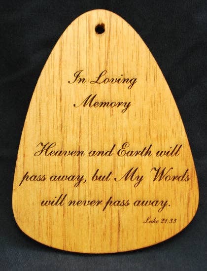 A wooden plaque with the In Loving Memory® Bronze 24-inch Windchime serves as a memorial tribute.