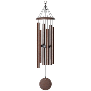 The Corinthian Bells® 36-inch Windchime, featuring bronze-colored tubular metal chimes and a circular weight hanging from a loop, is perfectly suited for any landscape design. This elegant chime adds a tasteful touch to your outdoor space.