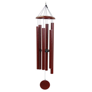 The Corinthian Bells® 60-inch Windchime features a set of red metallic tubes hanging from a circular top piece, with several cylindrical tubes of varying lengths tuned to a major 7th chord, and a round windcatcher at the bottom.