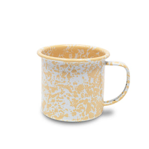 The Splatter Enamelware 12 oz Mug features a beige and white speckled design with a handle, displayed on a white background.