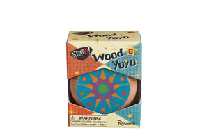 A colorful classic Neato! Wood Yo-Yo in packaging marked with “Neato! Classics wood yo yo,” featuring a vivid blue and orange mandala pattern on its surface. It also displays a choking hazard warning.