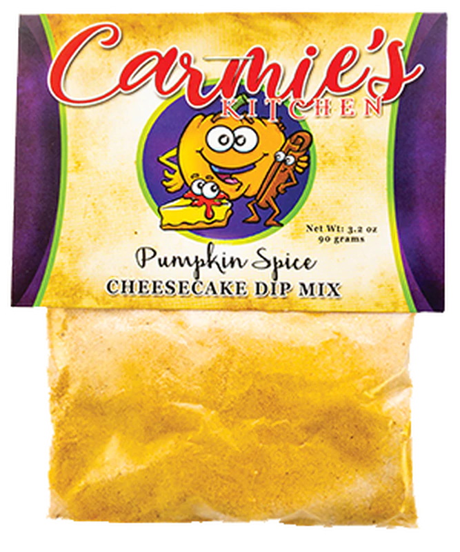 A 3.2 oz (90 grams) package of Pumpkin Spice Cheesecake Dip by Carmie's Kitchen, adorned with an illustration of a pumpkin and cheesecake slice on the label—an ideal holiday gift featuring delightful hints of pumpkin and cinnamon.