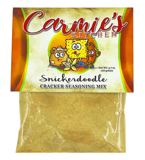 A 3.7 oz bag of Snickerdoodle Cracker Seasoning by Carmie's Kitchen, boasting a colorful label featuring animated crackers and infused with Saigon cinnamon for an authentic snickerdoodle flavor.