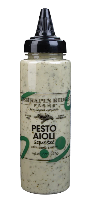 A Terrapin Ridge Pesto Aioli Squeeze in a plastic container.
